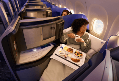 Woman eating in-flight meal on a United flight